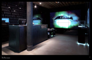 Photograph of Nike Soho store with Fuelband Product Displays, graphics and video wall